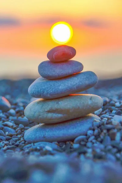 sunset beach meditation pebbles wallpaper