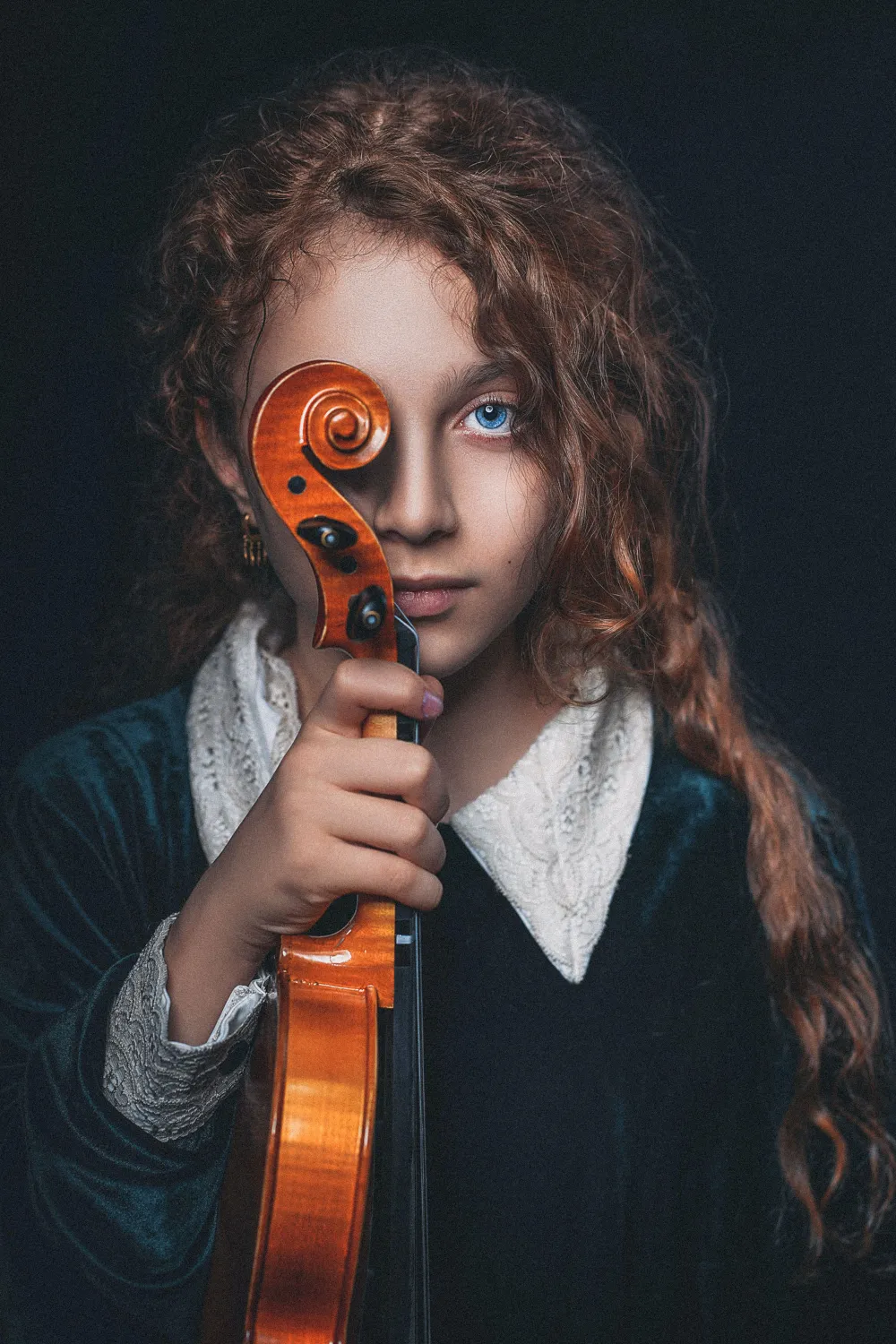 girl in black and white sweater holding brown violin wallpaper