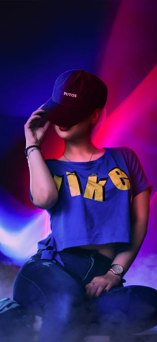 thumb for Girl Wearing A Blue Nike Shirt And A Black Cap Wallpaper