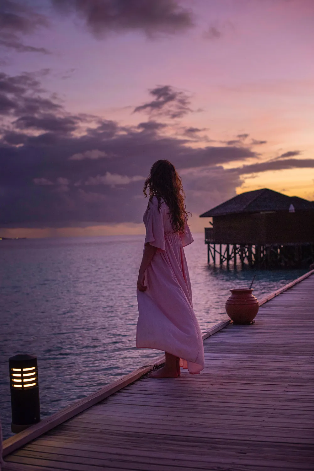 woman stands on dock wallpaper