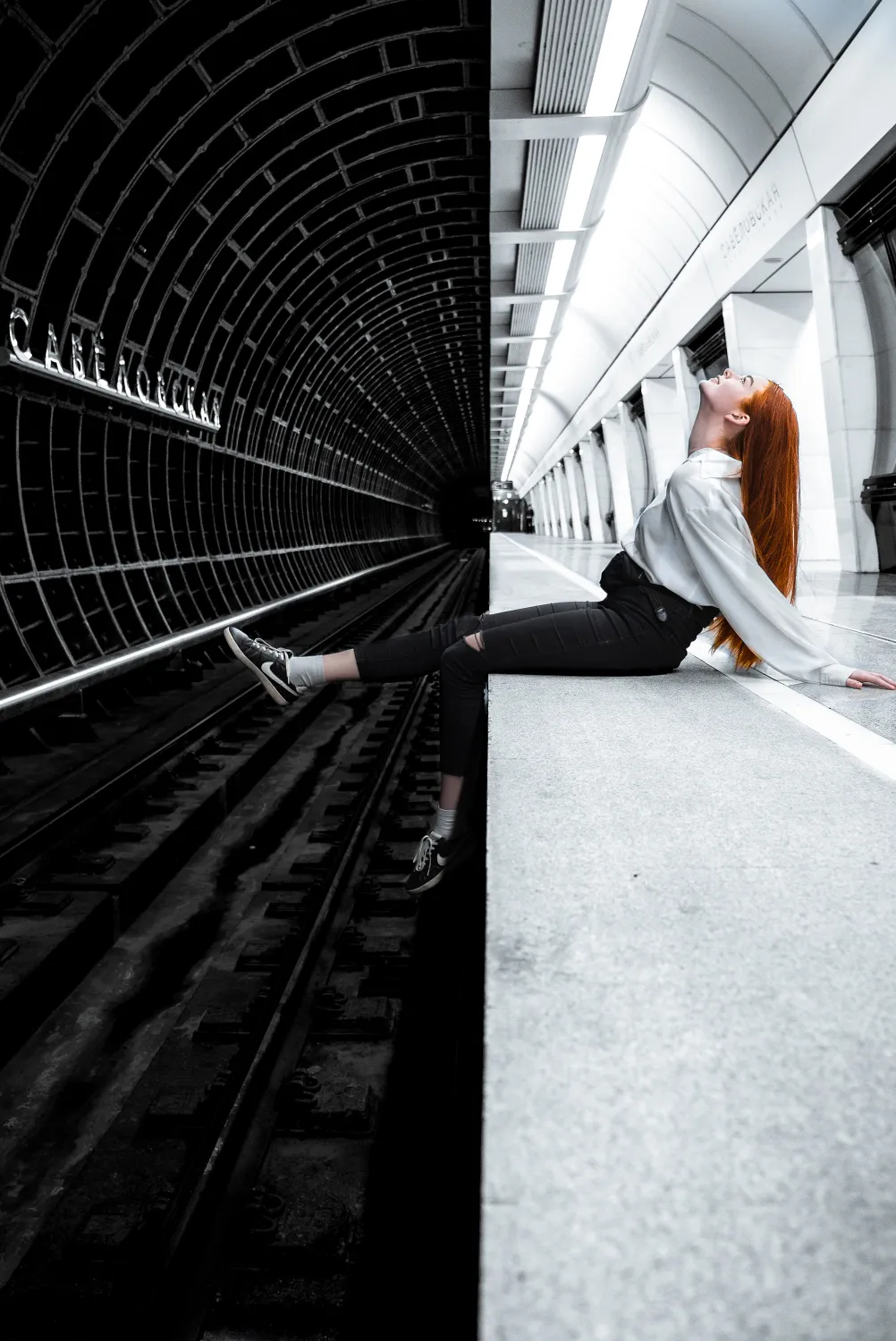 woman sitting on subway station wallpaper